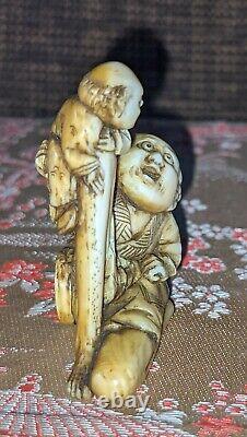Edo Period fine carved & stained Boxwood Netsuke depicting Ashinaga & tiny man
