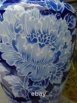 Japanese 12 inch tall blue and white porcelain vase with super colour and flower