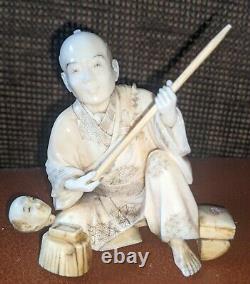 Meiji Netsuke okimono of a man with a spear superb detail signed by carver
