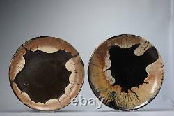 Two Japanese earthenware Tamba-tachikui dishes with abstract decoration, thir
