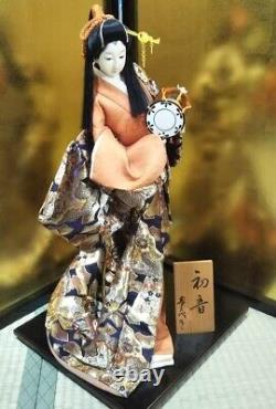 Vintage Japanese Geisha doll in Kimono 23 on wooden base Antique Orange Gold